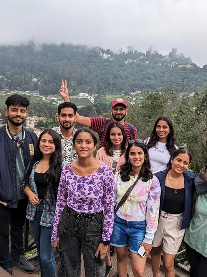 Another happy group photo from a scenic overlook in the hills.