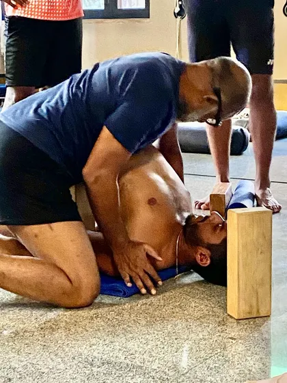A deep, assisted chest-opening stretch for a tennis player. This kind of passive stretching with a partner can help release tension in the pectoral muscles and improve shoulder mobility.