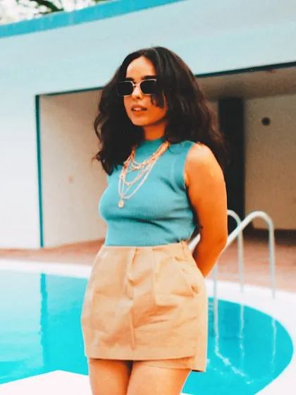 Another angle from the poolside shoot. It showcases a different, more fashion-forward side of my persona, away from the dark club environment.