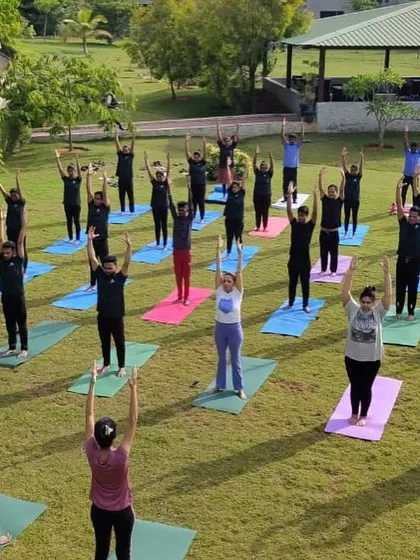 A full class of guests engaged in a morning yoga session. The sense of community and shared purpose adds another layer of healing to the experience.