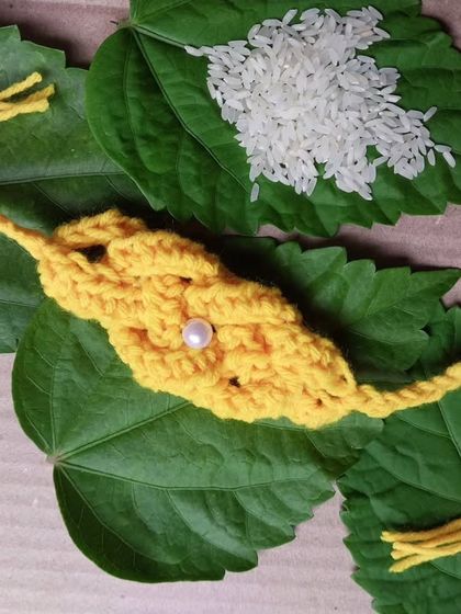 A unique, leaf-patterned crochet rakhi. I love experimenting with different shapes and styles.