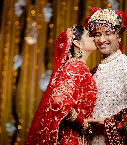 A sweet and spontaneous kiss on the cheek. This photo captures a moment of pure, unguarded affection.
