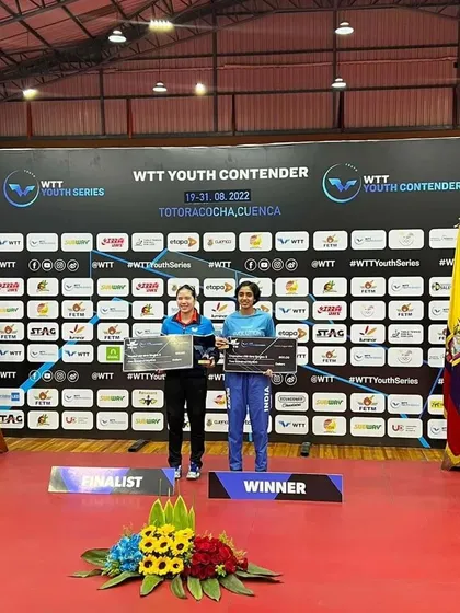 Yashaswini standing on the winner's podium after securing the gold medal in the U-19 girls' category at the WTT Youth Contender in Ecuador.