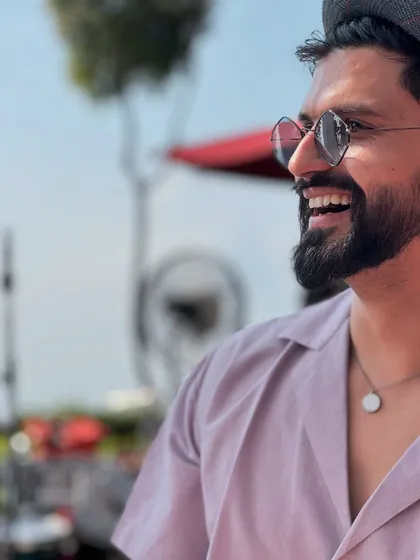 A simple mantra: just wear a smile and rule. A close-up candid shot capturing a happy moment.