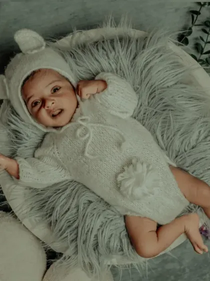 A happy little bear. This baby's sweet smile shows that my themed outfits are comfortable and fun to wear.