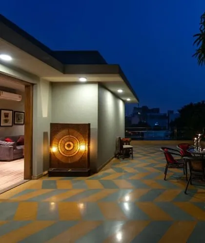 Openness, fresh air, and a seamless blend of indoor outdoor living. This villa terrace, with its bold geometric floor pattern, is designed to enhance the home with elegance.