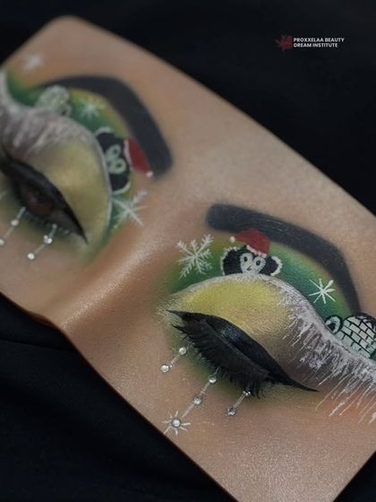 What do you think of this Christmas-inspired eye look? This practice board showcases our students' creativity and holiday spirit.