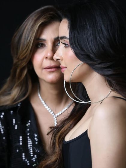 A more artistic, profile view of the mother and daughter. I like to explore different angles and compositions to create a diverse and compelling gallery.