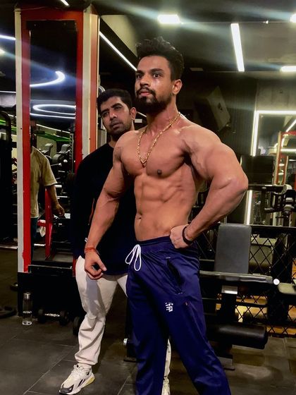 A member of Team Iron Champ. Here I am with one of my athletes, checking his condition and progress in the gym.