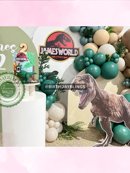 A Jurassic World-themed party with a realistic T-Rex cutout. The earthy green and brown balloons create a prehistoric jungle feel.