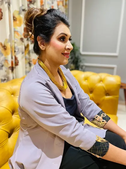 A side profile showcasing the flawless contour and elegant updo created for the shoot.