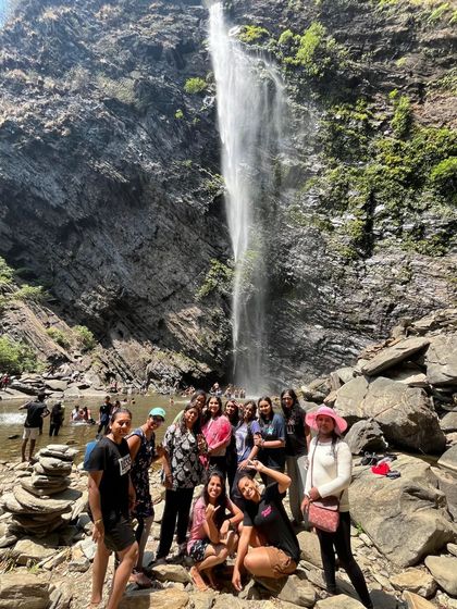 A group photo at a stunning waterfall during our coastal Karnataka trip covering Agumbe and Udupi.