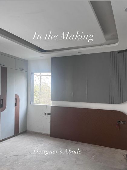 This photo shows a bedroom "in the making." The custom wardrobe and the feature wall behind the bed are being constructed, showing the bare bones of the design before the final finishes are applied.