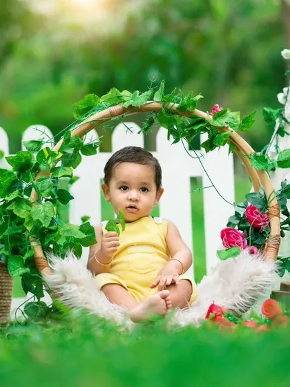 A curious little one enjoying the fresh air during an outdoor shoot. The "Boys Only!" sign on the teepee adds a playful touch to this personalized setup.