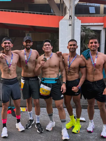 This is the result of showing up, for yourself and for the crew. Celebrating a hard-earned finish after my first half marathon, surrounded by the community that made it possible.
