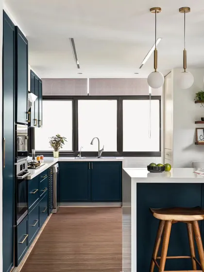 I love it when clients are open to using bold color. This deep blue kitchen has become a real centerpiece, proving that functional spaces can also be full of personality. We designed it with a breakfast bar for casual meals and smart storage to keep everything sleek and organized.