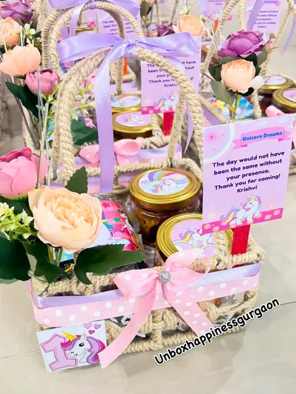 Another beautiful shot of the unicorn-themed jute basket, filled with goodies and adorned with flowers.