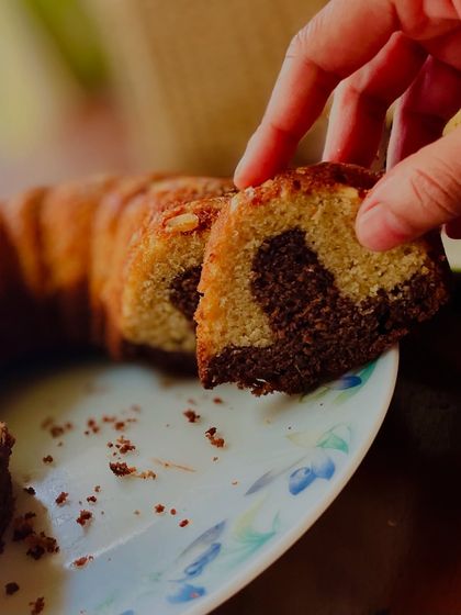 A close-up of a slice of the marble cake, showing the perfect swirl of vanilla and chocolate.