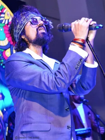 Lost in the music. This is me in my element, feeling every note during a live sufi rock performance. This is the passion I bring to every show, whether it's a large concert or an intimate wedding gig.