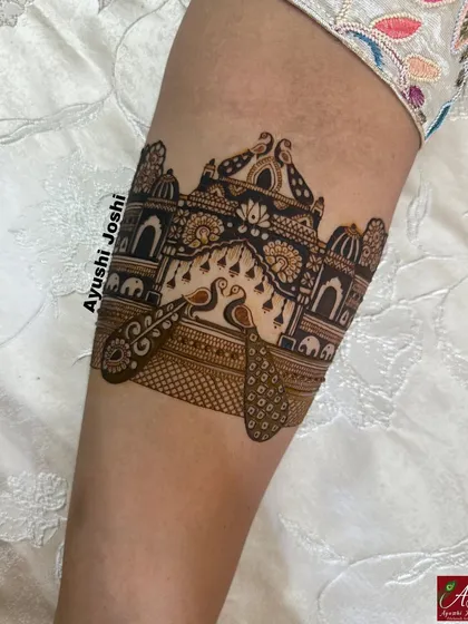 A close-up of a royal palace armband with peacocks, showcasing the intricate architectural details.