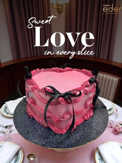 Sweet love in every slice. This vintage-style pink heart cake with black ribbon details is a unique and romantic dessert, perfect for an anniversary or special date night.