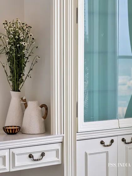 Softness in every corner, sophistication in every detail. This dreamy bedroom blends classic design, with its intricately carved moldings and pastel blue accents, with the calming energy of a modern sanctuary.