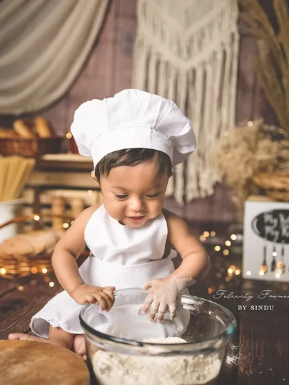 A different angle of our little chef, showing the full rustic kitchen setup. Every detail is carefully chosen to bring the theme to life.