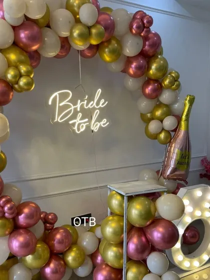 Another perspective of the popular bridal shower setup, showing the champagne bottle foil balloon which adds a fun, celebratory touch.