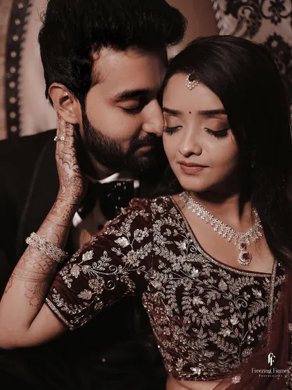 An intimate reception portrait where the groom's gentle touch and the bride's serene expression tell a story of deep affection. These are the moments that truly matter.