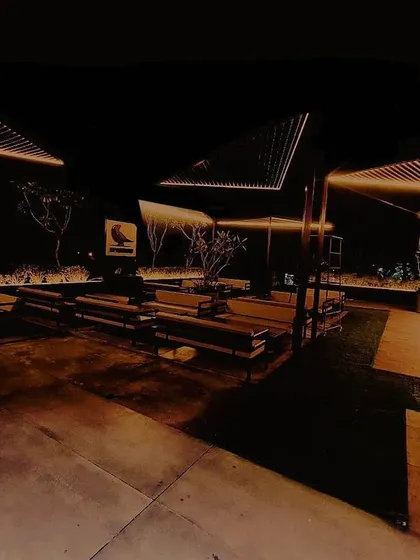 This terrace lounge lighting was designed to rule the darkness. I used minimalist linear fixtures to create geometric canopies of light overhead, defining the outdoor seating area while preserving the ambiance of the night sky. The result is a chic and dramatic open-air experience.