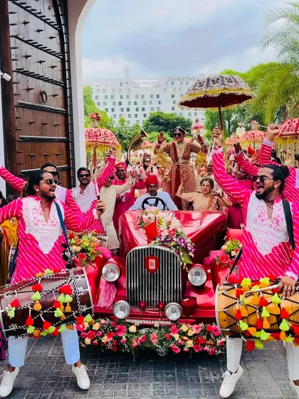 A royal entry for a royal couple. We love coordinating with your theme, like this baraat featuring a vintage car, to create picture-perfect moments with our high-energy dhol beats.