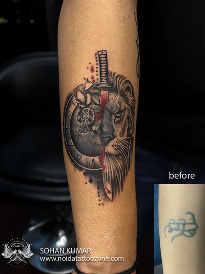 Here is a powerful cover-up transformation. We designed a custom piece featuring a lion's face and a broken clock with a sword to completely hide an old, unwanted tattoo, turning it into a bold statement of strength and time.