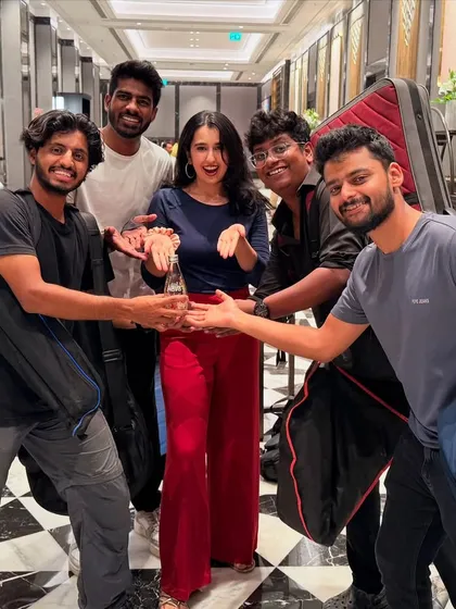 The band celebrating together after a gig. We travel across India for shows, from Pune and Hyderabad to Udaipur and Chennai.