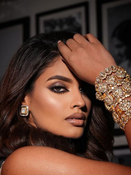 Another beautiful close up, highlighting the golden cuff and the perfectly blended eye makeup.