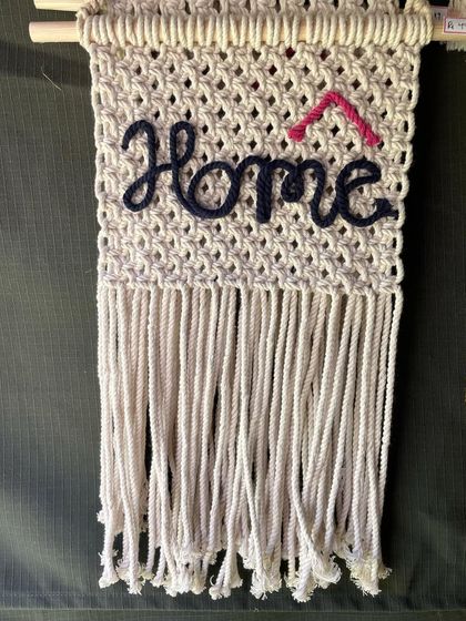 A simple yet stylish wall hanging for your entryway or living room. I love how the navy blue 'Home' script pops against the off-white macrame.