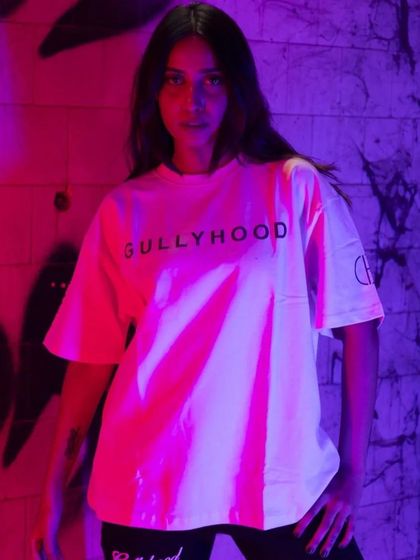 Using colored gels in the studio to create a vibrant, edgy look. This technique is perfect for making simple t-shirts look visually exciting for social media and online stores.