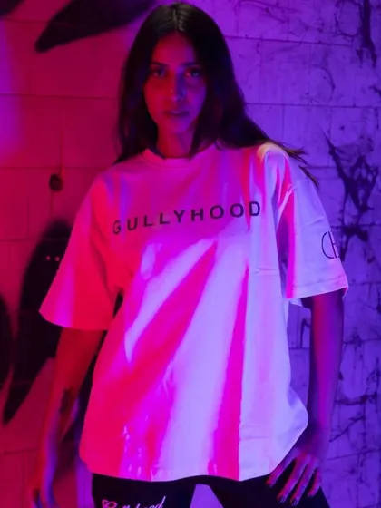 Using colored gels in the studio to create a vibrant, edgy look. This technique is perfect for making simple t-shirts look visually exciting for social media and online stores.