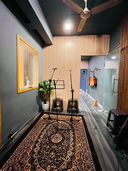 Our vocal recording area, set up with microphone stands and stools, ready for singers to practice or lay down tracks.