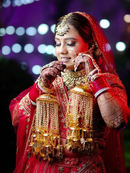 A profile shot of the bride with her 'kalire', highlighted against a colorful background.