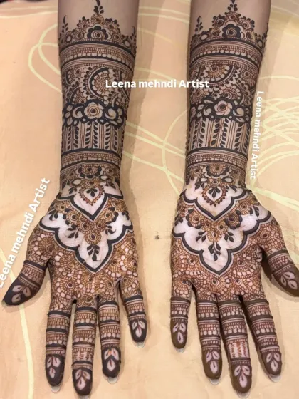This is a classic full-coverage bridal design. I've used a mix of bold outlines and delicate, fine-line shading to create depth, incorporating traditional motifs like paisleys and florals that extend up the arm.