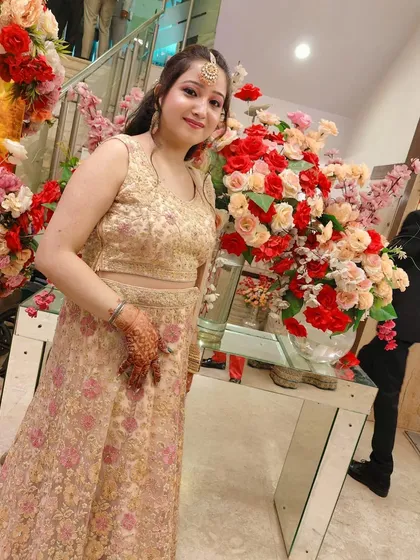 A client looking lovely in a beige floral embroidered lehenga. This is a classic and elegant rental choice for any festive occasion.