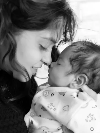 A tender black and white moment between a mother and her newborn baby. We encourage parents to join in for some truly emotional and memorable family portraits.