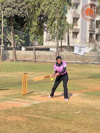 A batter in a pink jersey focuses intently as she plays a shot in the women's PPL.