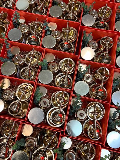 The complete set of brass puja items, neatly arranged in their festive boxes. This shows our capacity for handling large, uniform orders with precision.