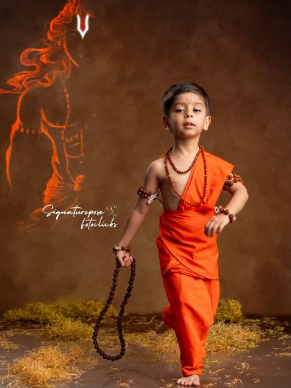 A full-length portrait of a young boy as Lord Rama, capturing a sense of purpose and strength.