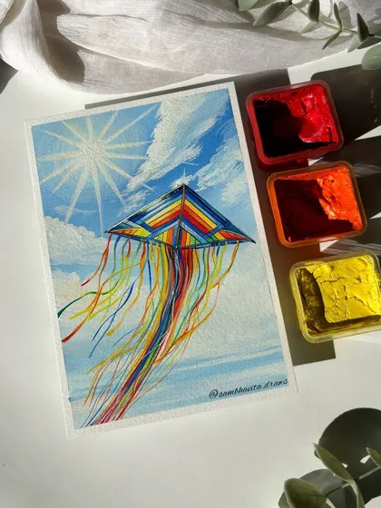 The full kite painting, complete with the gouache color pots I used to create it. It’s a bright and cheerful piece.