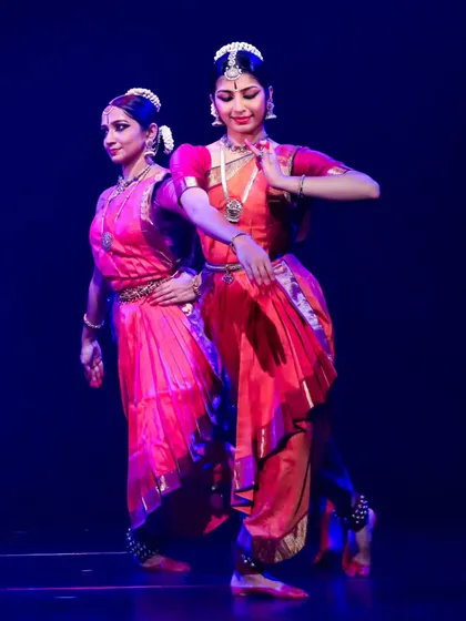 This image shows the beautiful mirroring and symmetry that can be achieved in a duet. It's a visual representation of two artists moving as one.