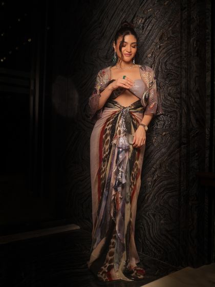 A full-length view of this radiant and flawless look. The makeup is subtle yet impactful, perfect for a high-fashion event.