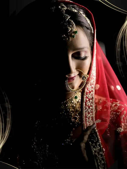 I believe a bridal portrait should be a piece of art. Using dramatic shadow and light, I focus on the bride's serene expression, her intricate nath, and the delicate details of her veil, creating an image that is both powerful and deeply personal.