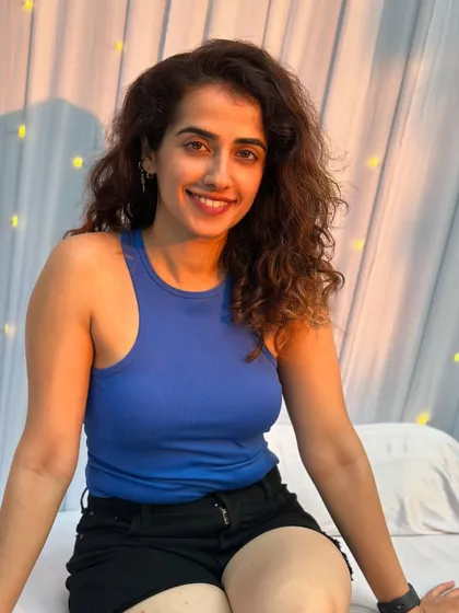 A moment of rest and a happy smile during the Bliss Tree Festival. These events are as much about community and joy as they are about the practice.
